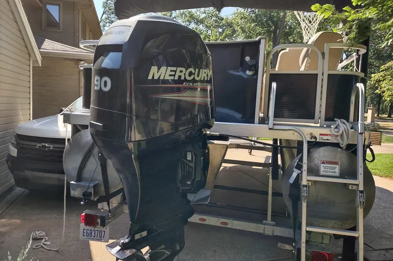 Slide: The Image of 2013 Bennington 22 SSX pontoon boat with Mercury 90 horsepower outboard motor. - 2