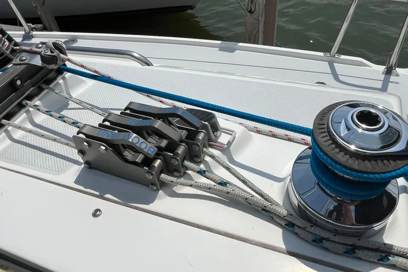Slide: The Image of Sailing equipment on a 2000 Catalina 320 yacht, featuring winches and ropes. - 10