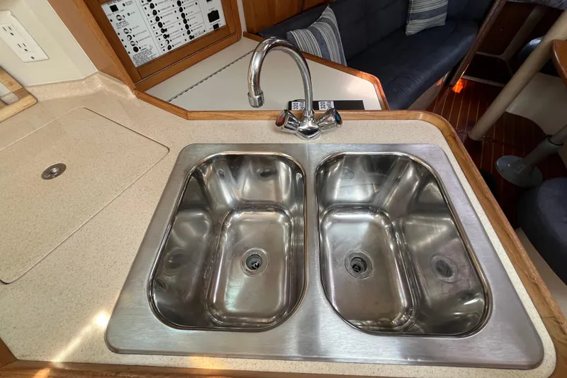 Slide: The Image of Double stainless steel sink in 2000 Catalina 320 yacht kitchen area. - 14