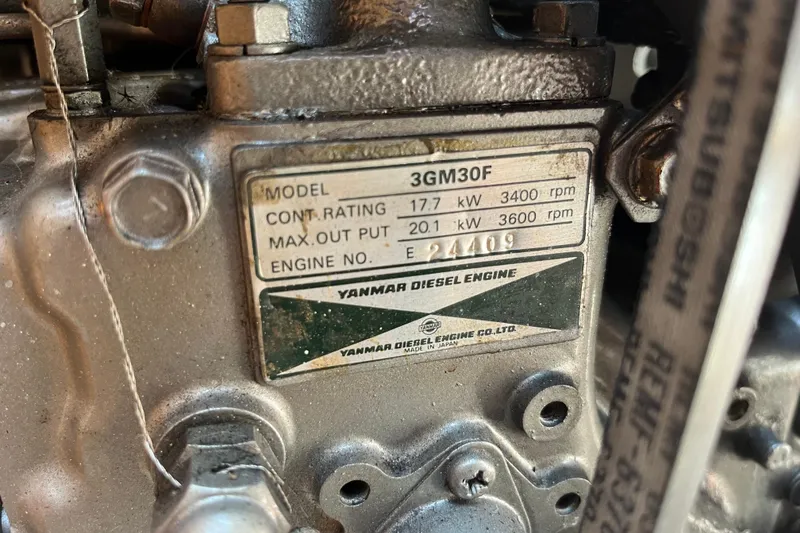 Slide: The Image of Yanmar 3GM30F diesel engine label on a 2000 Catalina 320 sailboat. - 25