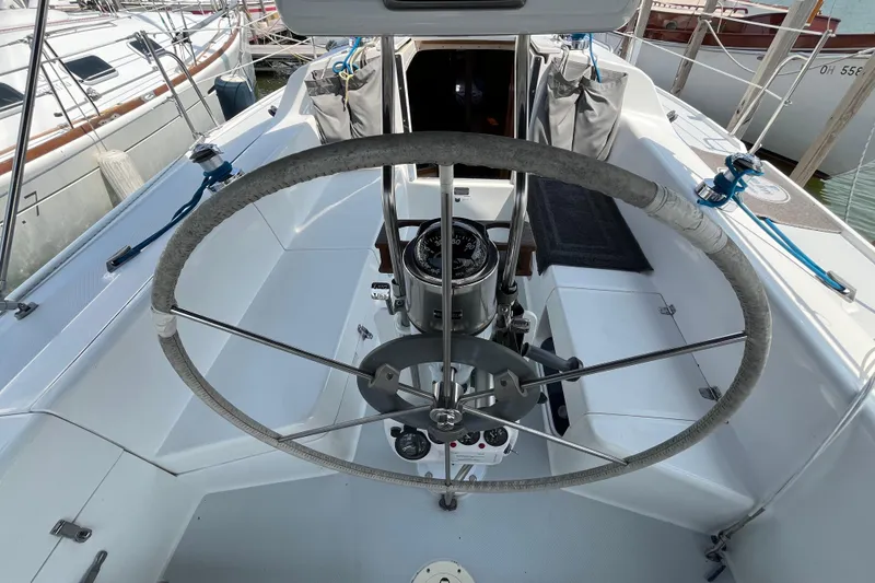 Slide: The Image of Cockpit of a 2000 Catalina 320 sailboat with steering wheel and navigation instruments. - 3