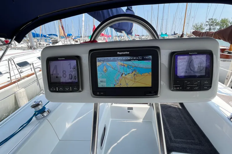 Slide: The Image of Catalina 320 yacht cockpit with Raymarine navigation displays, 2000 model, docked in marina. - 4