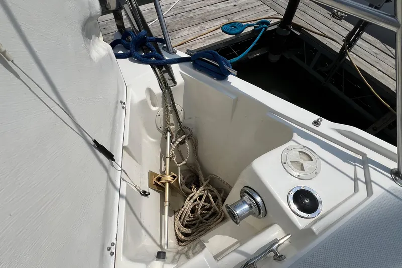 Slide: The Image of Anchor locker of a 2000 Catalina 320 sailboat with ropes and winch. - 7