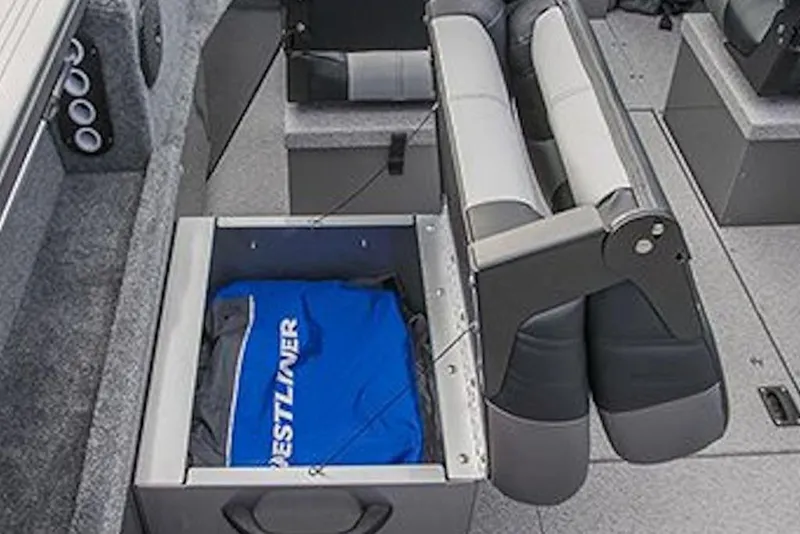 Slide: The Image of 2026 Crestliner 1850 Commander boat interior with storage compartment and seating. - 10
