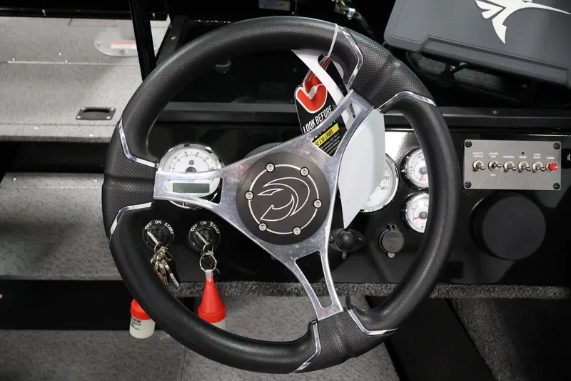 Slide: The Image of Steering wheel and dashboard of 2026 Crestliner 1850 Commander boat. - 16
