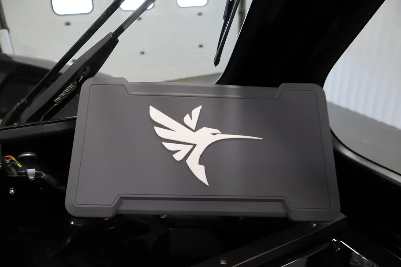 Slide: The Image of 2026 Crestliner 1850 Commander dashboard with sleek emblem design. - 17