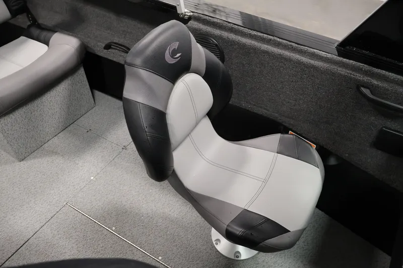 Slide: The Image of 2026 Crestliner 1850 Commander boat interior with gray and black seating. - 26