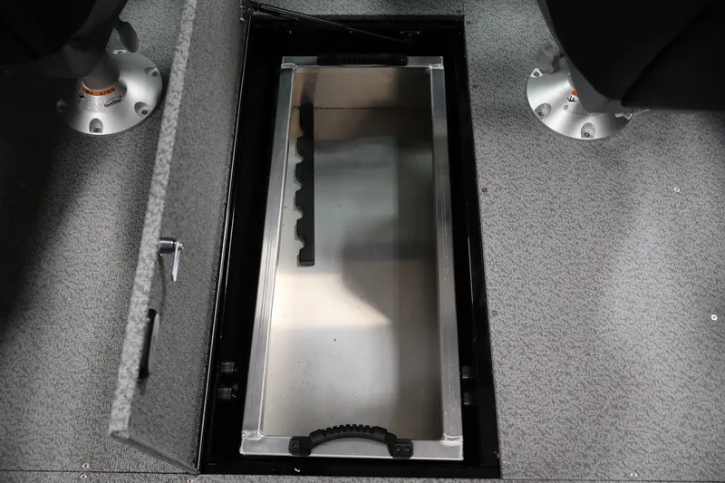 Slide: The Image of 2026 Crestliner 1850 Commander boat interior storage compartment with open lid. - 27