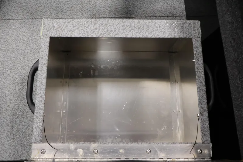 Slide: The Image of Storage compartment in 2026 Crestliner 1850 Commander boat, featuring durable metal construction. - 29