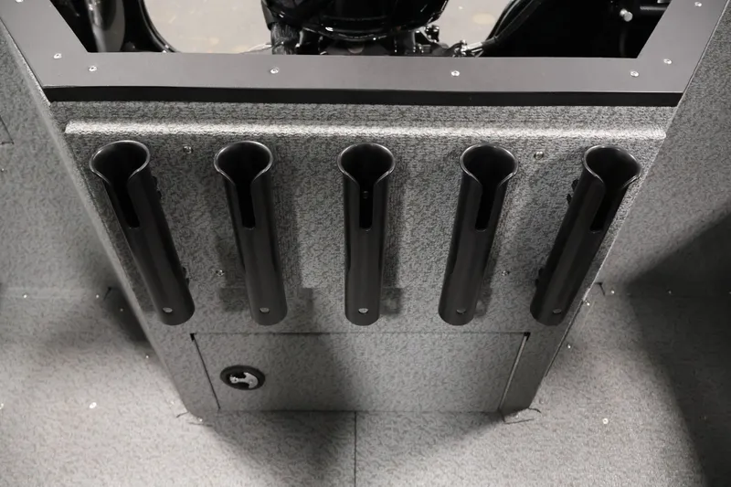 Slide: The Image of 2026 Crestliner 1850 Commander boat rod holders and storage compartment. - 30