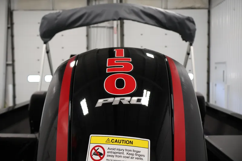 Slide: The Image of Outboard motor on 2026 Crestliner 1850 Commander, featuring "150 Pro" label and caution sticker. - 36