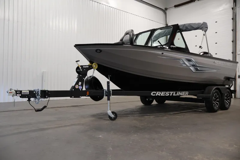 Slide: The Image of 2026 Crestliner 1850 Commander boat on trailer in indoor setting. - 41