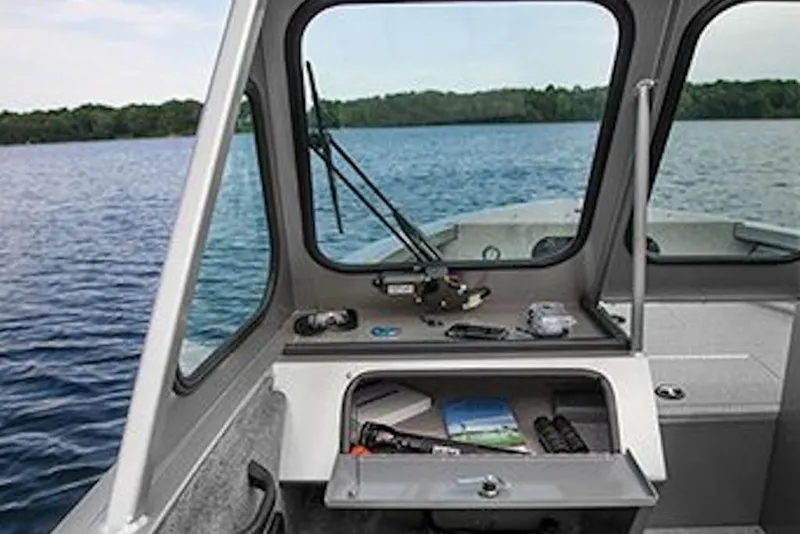 Slide: The Image of Interior view of 2026 Crestliner 1850 Commander boat on a lake. - 9