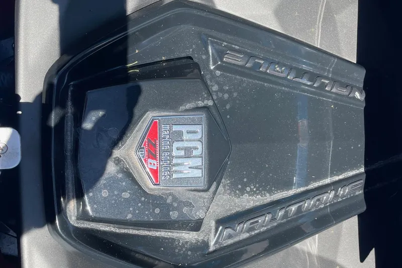 Slide: The Image of 2022 Nautique Super Air Nautique G25 engine cover with PCM branding. - 16