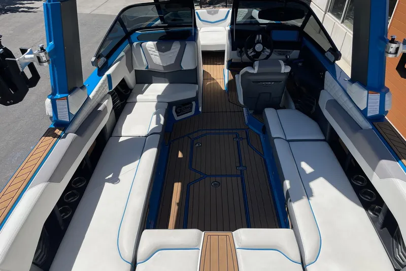Slide: The Image of 2022 Nautique Super Air Nautique G25 interior with spacious seating and modern design. - 7