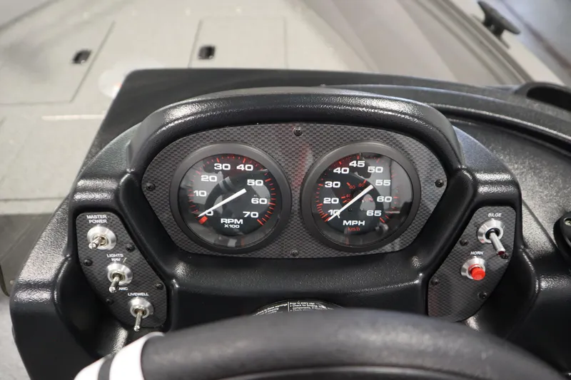 Slide: The Image of Dashboard of 2026 Crestliner 1650 Kodiac SC boat with speedometer and controls. - 22