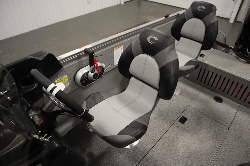 Slide: The Image of 2026 Crestliner 1650 Kodiac SC boat interior with steering wheel and two seats. - 29