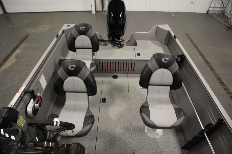 Slide: The Image of 2026 Crestliner 1650 Kodiac SC boat interior with four seats and steering wheel. - 30