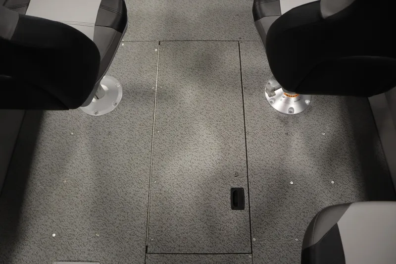 Slide: The Image of 2026 Crestliner 1650 Kodiac SC interior with two seats and textured flooring. - 31