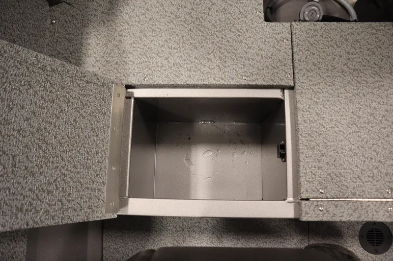 Slide: The Image of Storage compartment in 2026 Crestliner 1650 Kodiac SC boat, featuring a textured interior. - 36