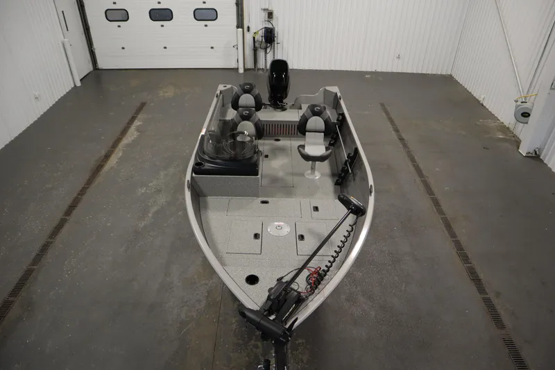 Slide: The Image of 2026 Crestliner 1650 Kodiac SC fishing boat in a spacious indoor garage. - 8
