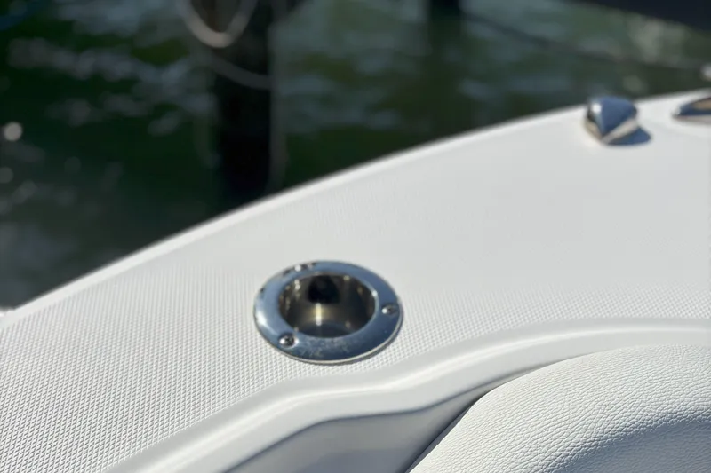 Slide: The Image of Close-up of 2024 Edgewater 262CC boat deck with metal fixture. - 11