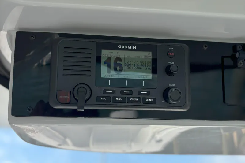 Slide: The Image of Garmin marine radio on 2024 Edgewater 262CC boat dashboard, displaying coordinates and time. - 15