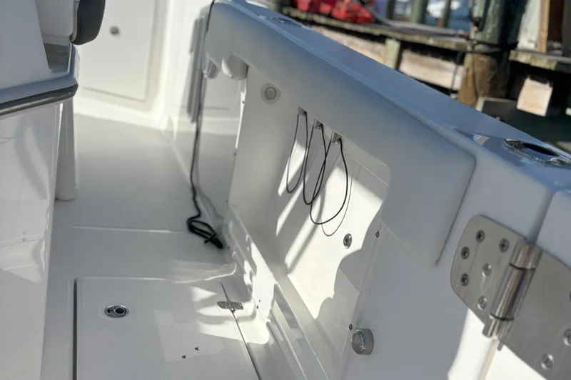 Slide: The Image of 2024 Edgewater 262CC boat interior with sleek white finish and modern fittings. - 4