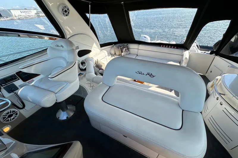 Slide: The Image of Luxurious interior of 2001 Sea Ray 510 Sundancer yacht with white leather seating. - 10