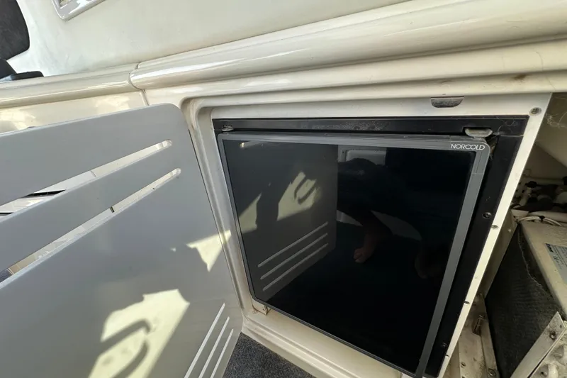 Slide: The Image of Norcold refrigerator on a 2001 Sea Ray 510 Sundancer yacht interior. - 12