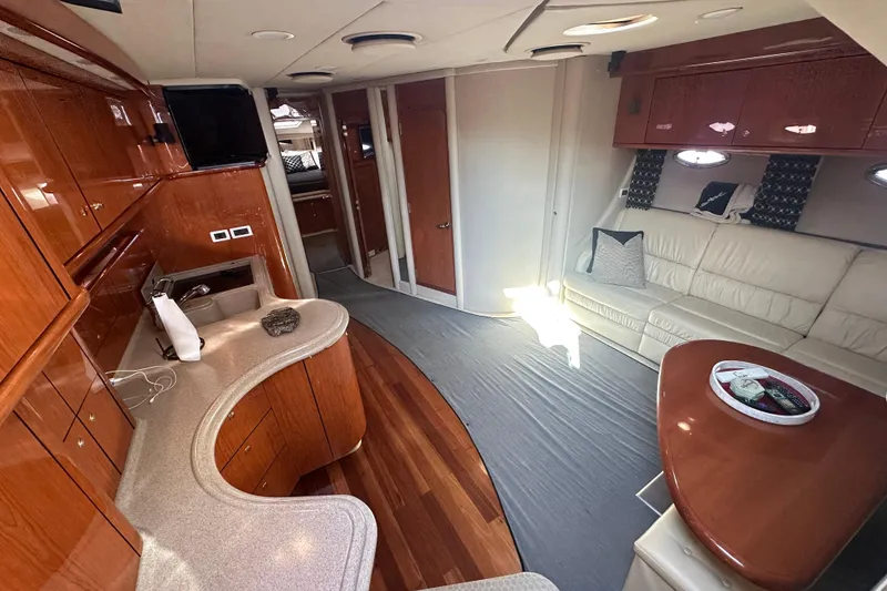 Slide: The Image of Luxurious interior of 2001 Sea Ray 510 Sundancer yacht with elegant wood finishes. - 13