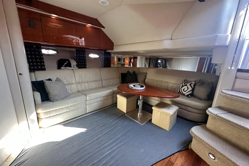 Slide: The Image of Luxurious interior of 2001 Sea Ray 510 Sundancer yacht with plush seating and elegant decor. - 15