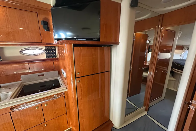 Slide: The Image of Luxurious interior of 2001 Sea Ray 510 Sundancer yacht with wood cabinetry and modern amenities. - 18
