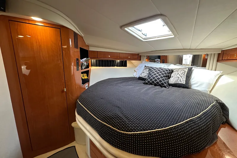 Slide: The Image of Luxurious cabin interior of 2001 Sea Ray 510 Sundancer yacht with elegant bedding. - 21