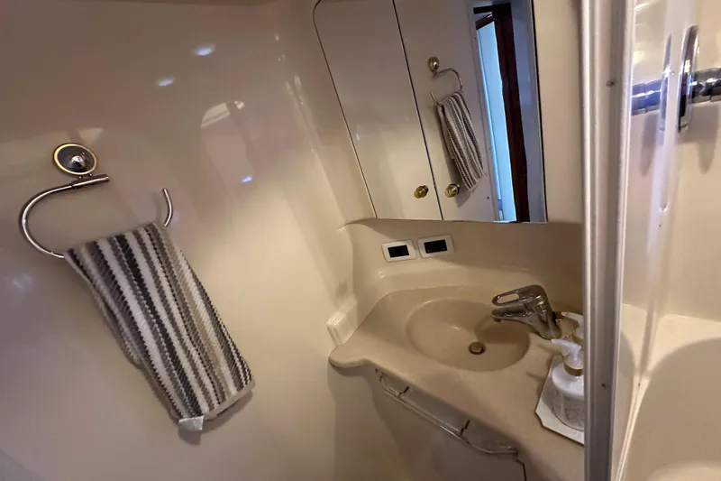 Slide: The Image of Bathroom interior of 2001 Sea Ray 510 Sundancer yacht with sink and towel. - 28