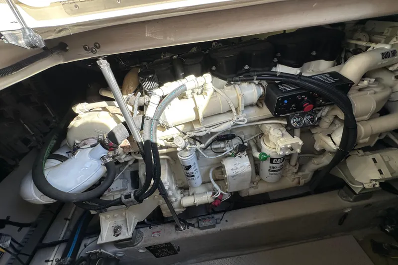Slide: The Image of Engine compartment of a 2001 Sea Ray 510 Sundancer boat, showcasing mechanical components. - 29