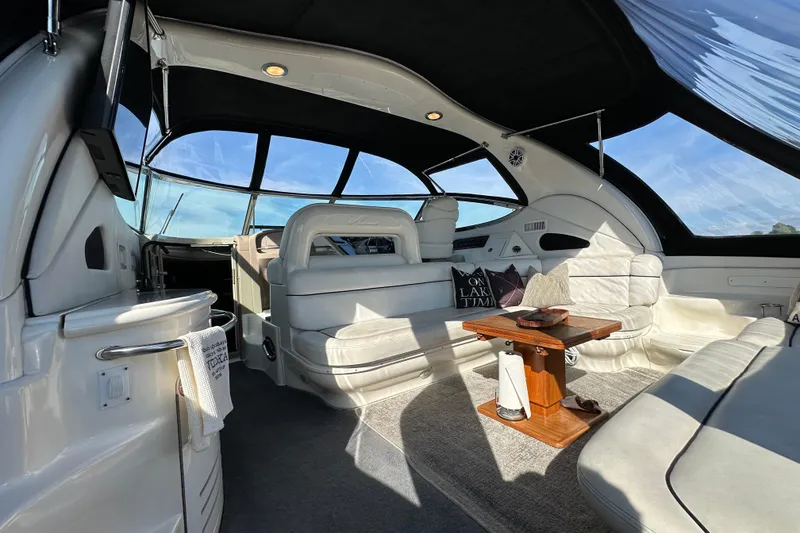 Slide: The Image of Luxurious interior of 2001 Sea Ray 510 Sundancer yacht with elegant seating and table. - 3