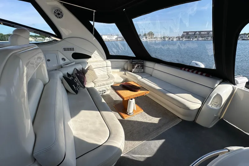 Slide: The Image of Luxurious interior of 2001 Sea Ray 510 Sundancer yacht with plush seating and scenic water view. - 4