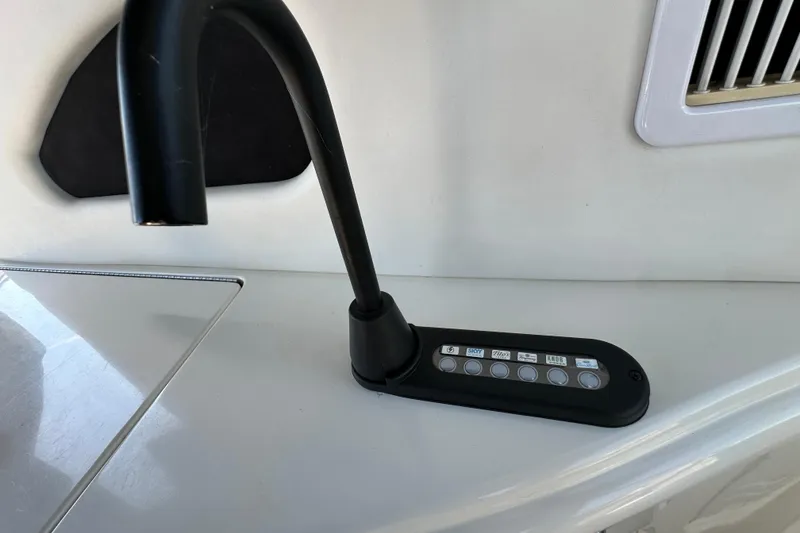 Slide: The Image of Control panel on 2001 Sea Ray 510 Sundancer yacht, featuring multiple buttons and a sleek design. - 7