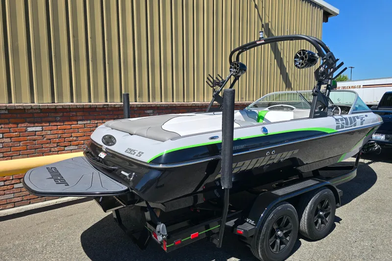 Slide: The Image of 2023 Sanger V215 boat on trailer, featuring sleek design and vibrant accents. - 22