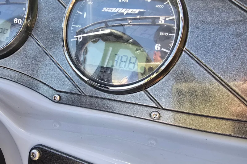 Slide: The Image of Close-up of 2023 Sanger V215 boat dashboard gauges. - 24