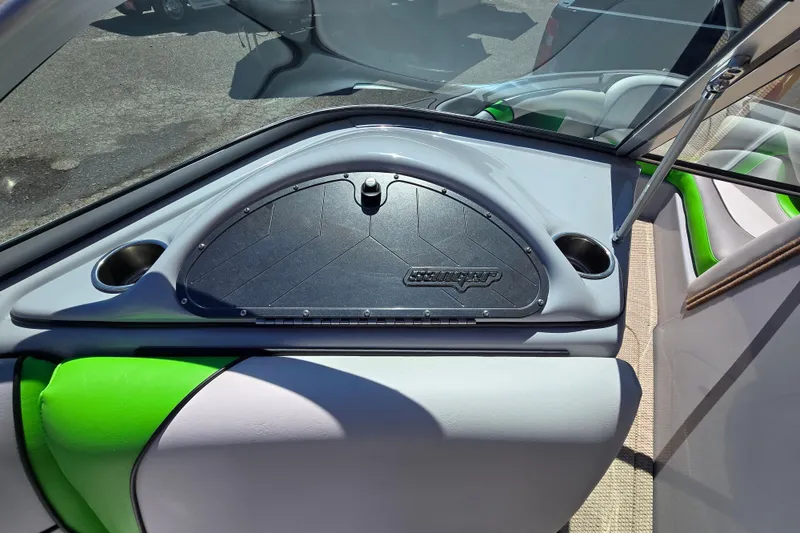 Slide: The Image of 2023 Sanger V215 boat interior with green accents and storage compartment. - 8