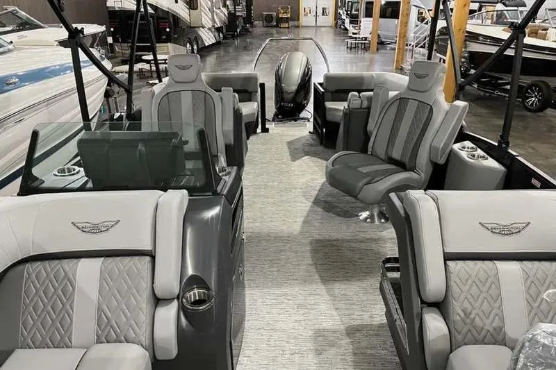 Slide: The Image of 2025 Bennington 22M Fastback SE pontoon boat interior with luxurious seating and modern design. - 4