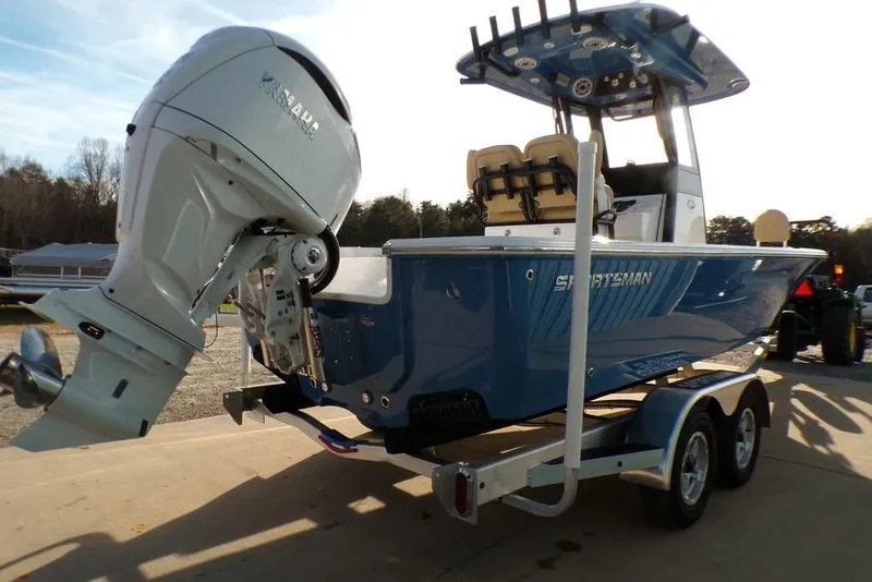 Slide: The Image of 2025 Sportsman Masters 247 boat on trailer with powerful outboard motor. - 11