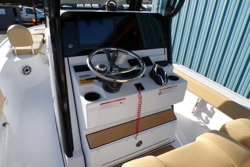 Slide: The Image of 2025 Sportsman Masters 247 boat cockpit with steering wheel and control panel. - 15