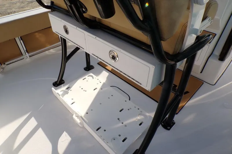 Slide: The Image of 2025 Sportsman Masters 247 boat interior with storage compartments and seating. - 23