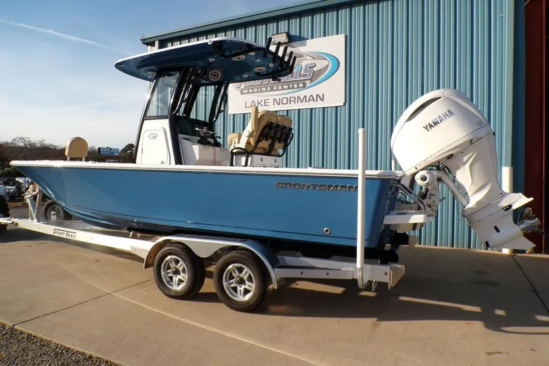 Slide: The Image of 2025 Sportsman Masters 247 boat on trailer, blue hull, Yamaha engine, at Lake Norman Marine Center. - 3