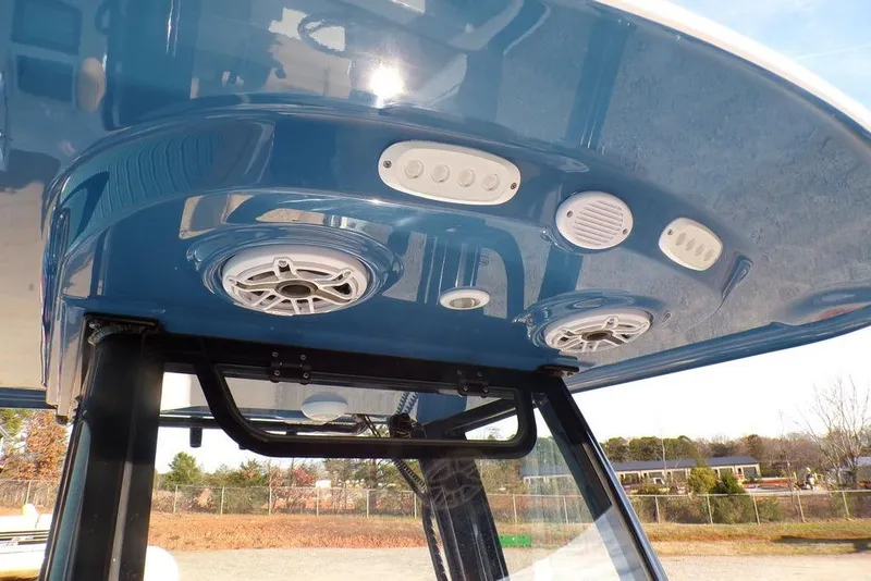 Slide: The Image of 2025 Sportsman Masters 247 boat T-top with integrated speakers and lights. - 30