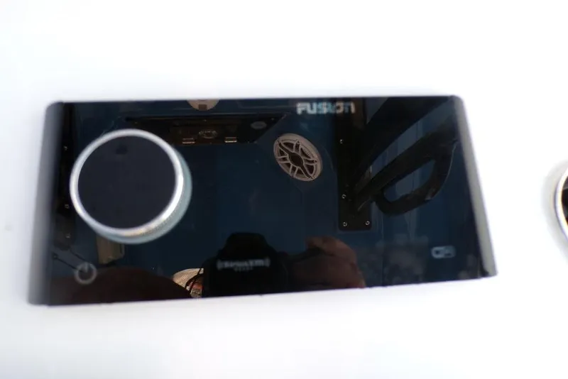 Slide: The Image of Fusion audio control panel on 2025 Sportsman Masters 247 boat dashboard. - 40