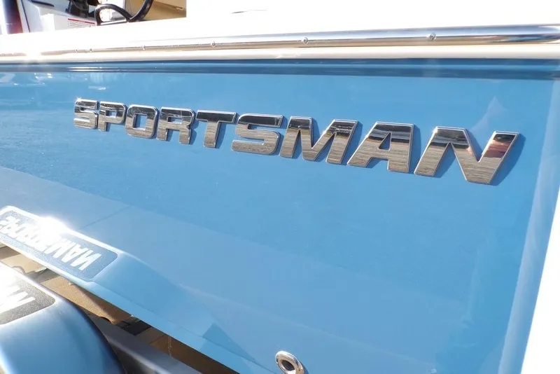 Slide: The Image of 2025 Sportsman Masters 247 boat with metallic logo on blue hull. - 42